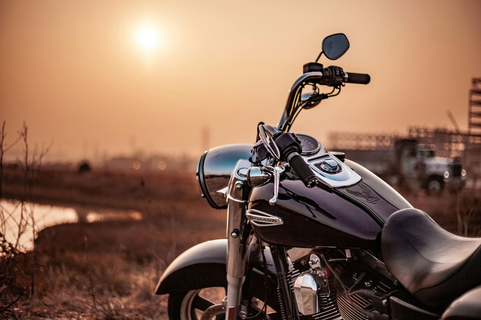 Motorcycle parked at sunset